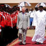 Britain’s Prince Charles reviews an honor guard with Gambia’s President Adama Barrow at McCarthy Square during an official welcome ceremony in Banjul,