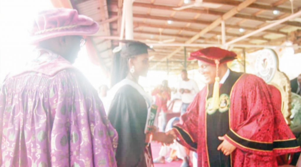 Inim receiving a handshake from Prof. Essien