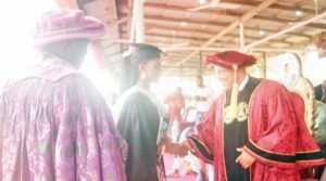 Inim receiving a handshake from Prof. Essien