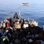 Migrants are seen as they are rescued by Libyan coast guards in the Mediterranean Sea off the coast of Libya