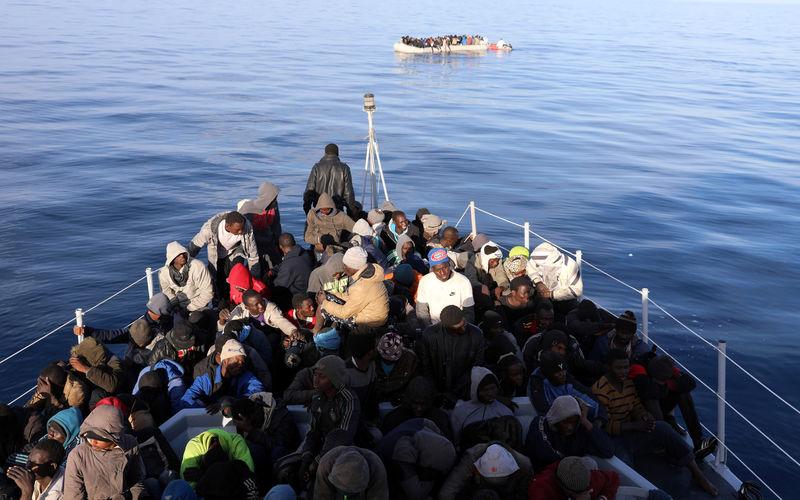 Migrants are seen as they are rescued by Libyan coast guards in the Mediterranean Sea off the coast of Libya