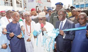 Obasanjo (middle) flanked by Governor Okowa (2nd right) and others, commissioning the stadium