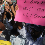 Pakistan shuts phone networks as Islamists protest over Christian woman