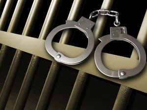 Prison-bars-and-handcuffs