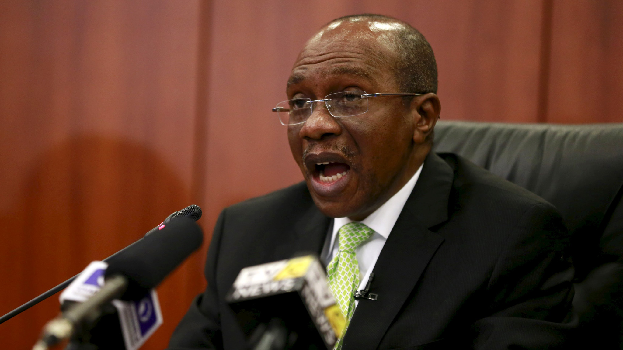 Governor Godwin Emefiele announces that Nigeria’s central bank is keeping its benchmark interest rate on hold at 13 percent in Abuja