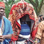 Baba Osun and Arugba bearing the Osun Osogbo