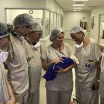Doctors with the baby