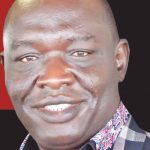 Dr Akin John