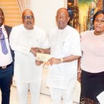 MD/Editor-in-Chief, The Sun Publishing Limited, Mr Eric Osagie (3rd left) presenting letter to Chief Lee Ikpea notifying him of his selection as The Sun Business Person of the Year 2018