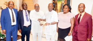 MD/Editor-in-Chief, The Sun Publishing Limited, Mr Eric Osagie (3rd left) presenting letter to Chief Lee Ikpea notifying him of his selection as The Sun Business Person of the Year 2018