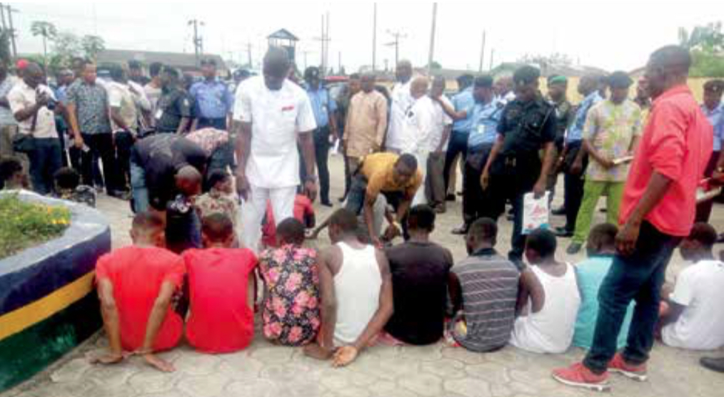 Some suspects being paraded by police officers in Yenagoa.
