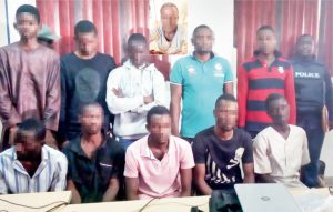 Suspected robbers paraded by the police in Abuja, yester- day. (Inset-) Leader of gang that killed Badeh