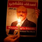 FILE PHOTO: A demonstrator holds a poster with a picture of Saudi journalist Jamal Khashoggi outside the Saudi Arabia consulate in Istanbul