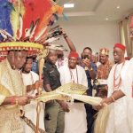 Igwe Chidume exchanges pleasantries with Obi of Onitsha while other watch