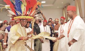 Igwe Chidume exchanges pleasantries with Obi of Onitsha while other watch