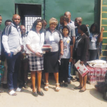 Members of foundation with gifts items to the prison inmates
