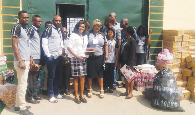 Members of foundation with gifts items to the prison inmates