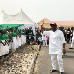 Elumelu acknowledging cheers from the crowd at the event