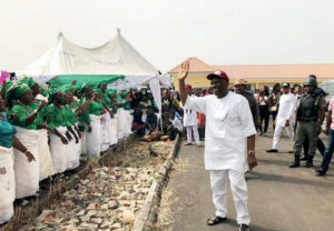 Elumelu acknowledging cheers from the crowd at the event