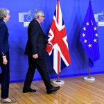 British Prime Minister Theresa May and European Commission President Jean-Claude Juncker arrive to discuss draft agreements on Brexit, at the EC headquarters in Brussels