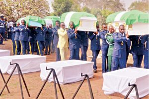 Remains of the gallant Air Force officers who died while fighting insurgents in Borno being laid to rest at the Military Cemetery, in Abuja, yesterday