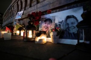 Flowers and candles in memory of Louisa Vesterager Jespersen and Maren Ueland are seen at the Town Hall Square in Copenhagen