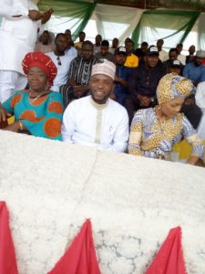Mustapha flanked by two females on the occasion