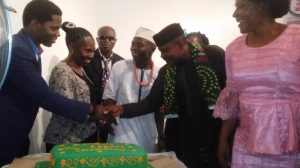 L – R Comrade Durotimi, Mrs Adeboye, Comrade Iroko, and others cutting the anniversary cake.