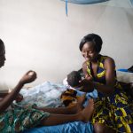 Woman-presented-with-her-baby-after-child-birth