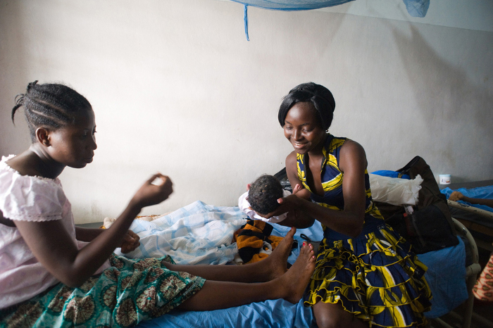 Woman-presented-with-her-baby-after-child-birth