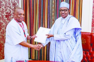 President Muhammed Buhari receiving grom former governor of Abia State and senator-elect, Dr. Orji Uzor Kalu a letter from Venezuelan President, Nicolas Maduro, at the State House, Abuja, yesterday
