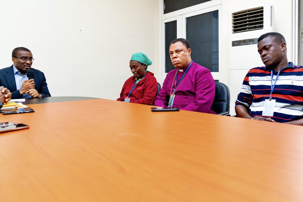 Chief of Staff David Edevwie (back, right) meeting with victim’s family