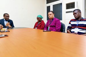 Chief of Staff David Edevwie (back, right) meeting with victim’s family