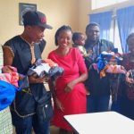 The philantropists with the children, mother and hospital managment