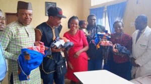 The philantropists with the children, mother and hospital managment