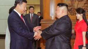 Xi-Jinping-with-Kim-Jong-Un-as-China-and-North-Korea-agree-to-foster-ties-despite-international-situations-e1561186685324