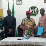 Gov Obiano handing over to Mr Sunday Ogbu a copy of signed MoU with Sunny Peace Cosmetics Ltd for production activities at Oba, Anambra State