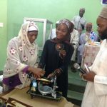Zakat-and-Sadaqat-Foundation-ZSF-presenting-sewing-machine-to-beneficiary