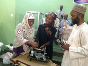 Zakat-and-Sadaqat-Foundation-ZSF-presenting-sewing-machine-to-beneficiary