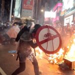 Hong Kong protesters clash with police, set fires