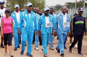 Ugwuanyi marching with NAF officers on the occasion