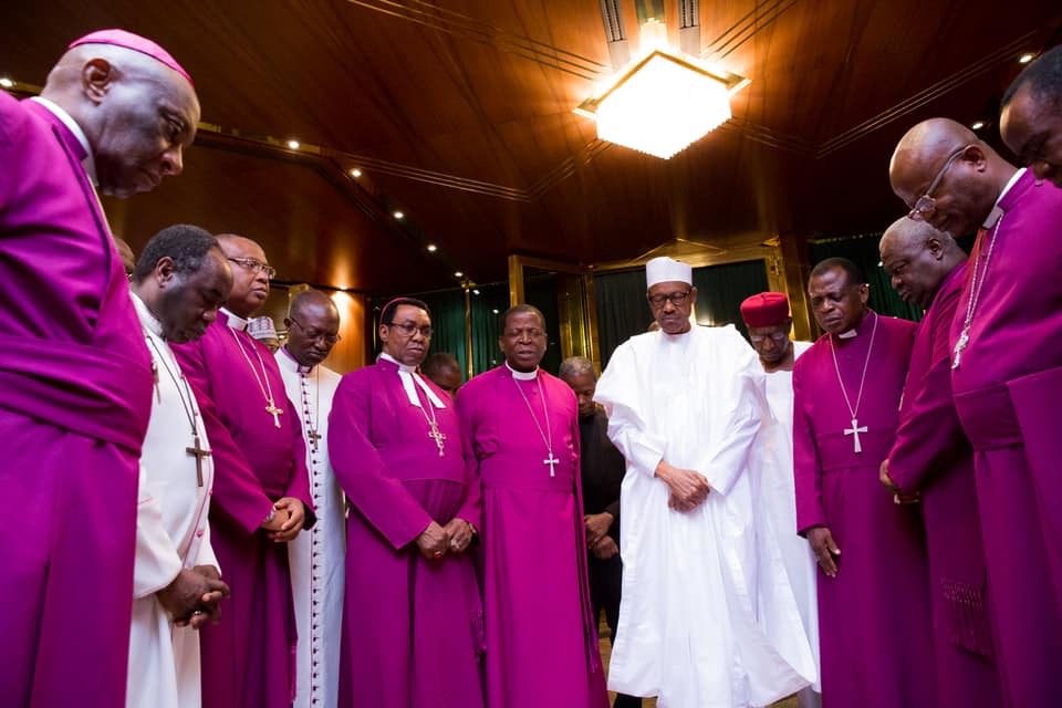 Rev. Nicholas Okoh (centre left)