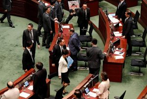 Hong Kong assembly in chaos; attack on democracy leader a ‘chilling signal’