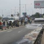 Disaster averted at Lagos airport as fuel tanker falls, spills contents on road
