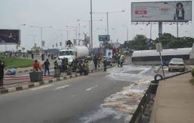 Disaster averted at Lagos airport as fuel tanker falls, spills contents on road