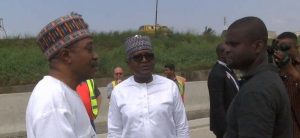 Emefiele (left), Dangote (middle)