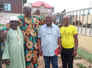 Adelakun (3rd left) and members of the community when he visited the area in August