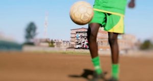 Football coach held for rape of 9-year-old boy