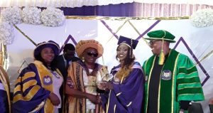 L-R: Professor Chinedum Babalola, Chief Winifred Awosika, Lauretta Onemu receiving her award and Mr Peter Obi watch