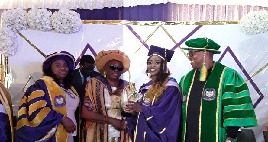 L-R: Professor Chinedum Babalola, Chief Winifred Awosika, Lauretta Onemu receiving her award and Mr Peter Obi watch